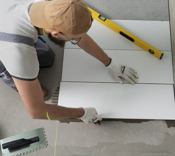 tiler working renovation apartment