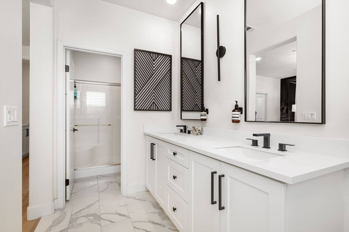 modern bathroom with dual sinks and black fixtures